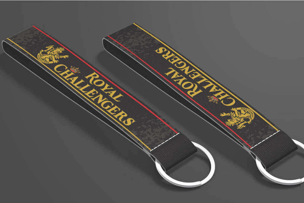 RCB key tags inspired by Royal Challengers Bangalore – red and gold IPL cricket keychains by Namu Customs.