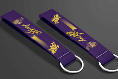 Kolkata Knight Riders IPL custom key tags featuring purple and gold design, showcasing team pride and spirit.
